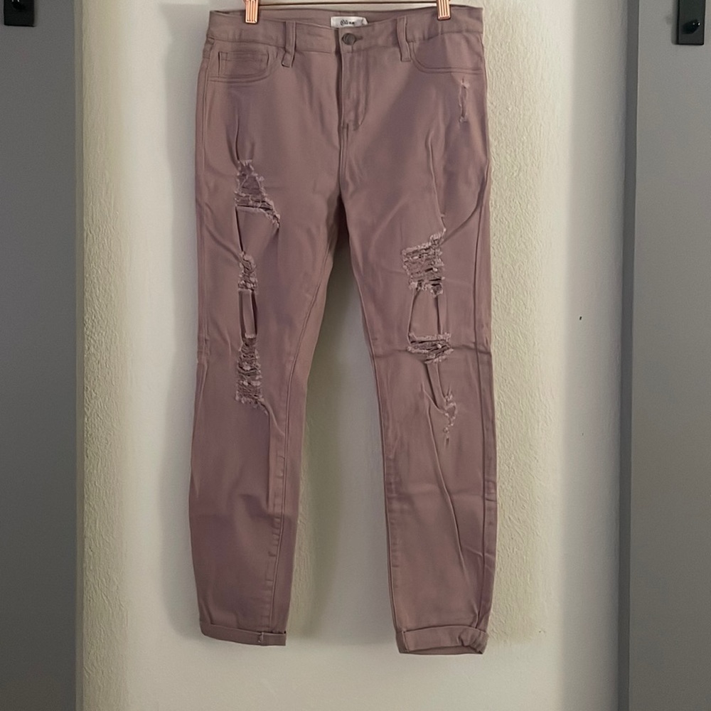 Dusty pink ripped jeans